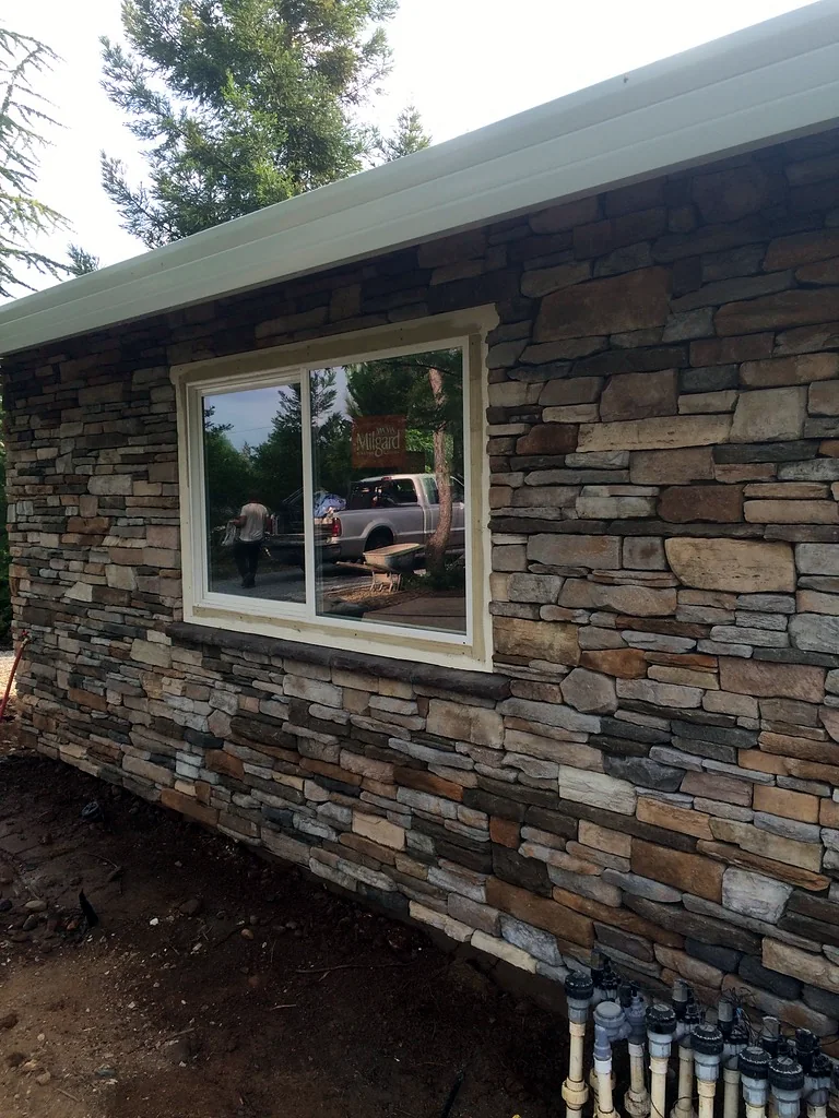 Stone veneer around a window