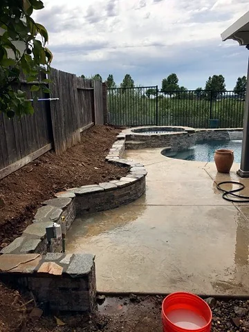 Stone pool planter wall