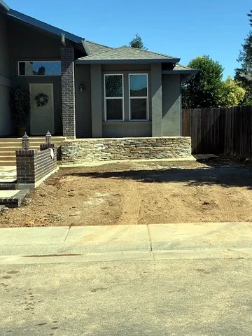 Stacked stone planter wall