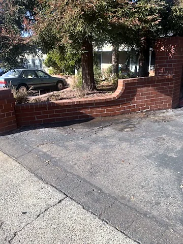 Curved brick planter wall