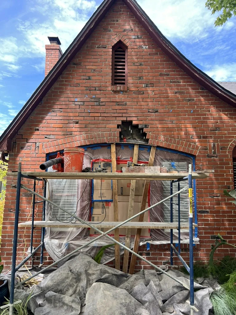 Before: Hole in the brick gable above the windows
