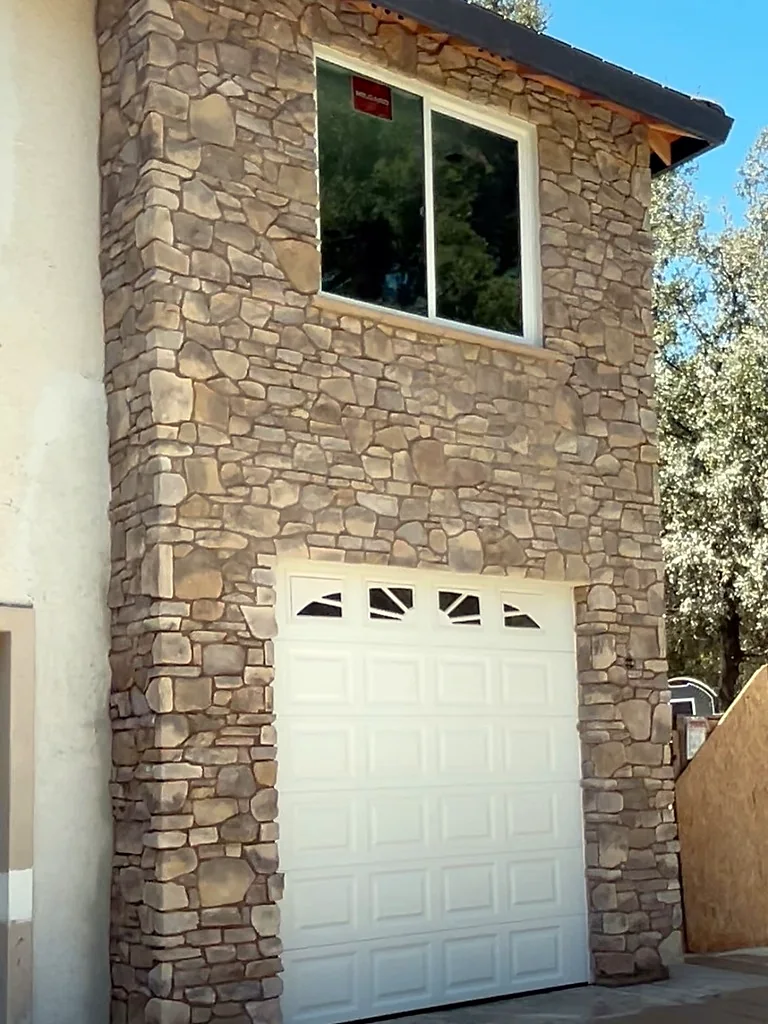 Stone veneer garage wall