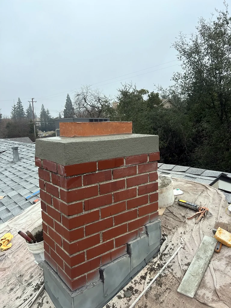 Brick chimney with new crown